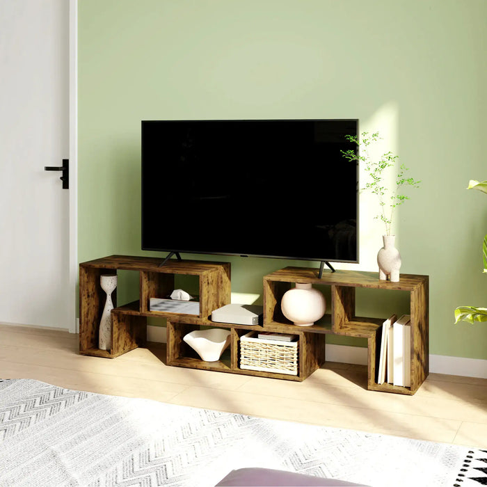 Rustic brown modular TV stand in a bright room with green wall, holding a large flat-screen TV and decorative items
