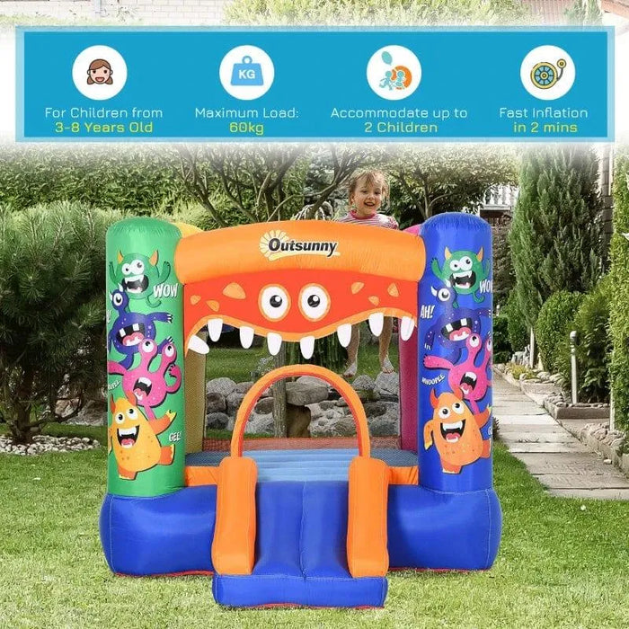 Outsunny monster inflatable bouncy castle with slide in garden, colorful cartoon design