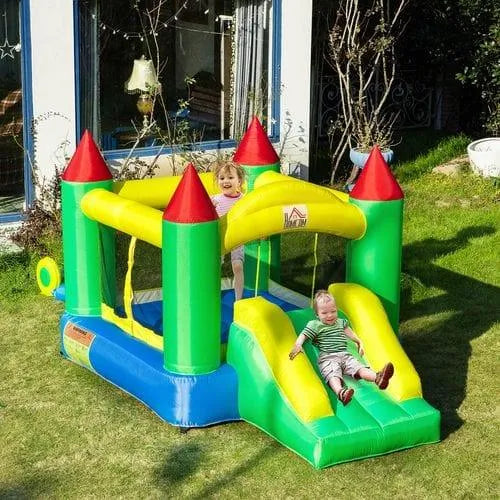 Kids playing on a colorful outdoor bouncy castle with slide in a sunny garden