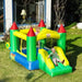 Kids playing on a colorful outdoor bouncy castle with slide in a sunny garden