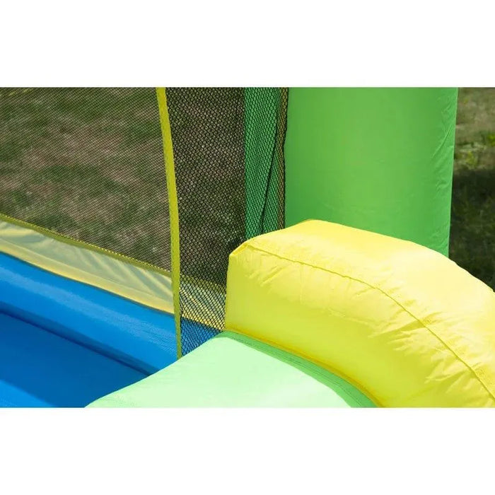 Close-up of multi-colour inflatable bouncy castle with mesh safety net outdoors