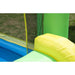 Close-up of multi-colour inflatable bouncy castle with mesh safety net outdoors