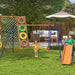Multi-coloured kids swing set with slide, glider and outdoor seating in garden
