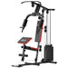 Home gym equipment with bench and pulley system on a white background