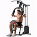 Man using a home gym machine on a white background