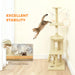 Cat jumping from beige multi-level cat tree with widened base for excellent stability