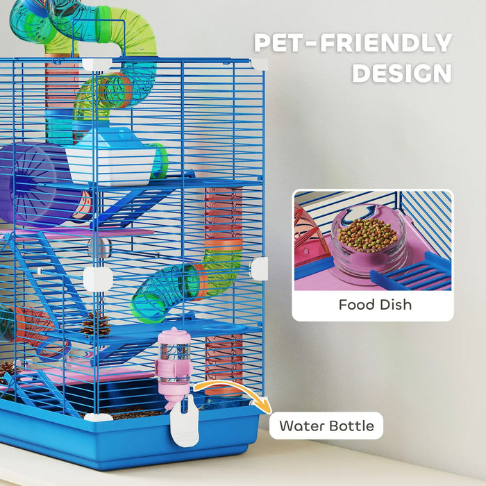 Blue multi-level pet cage with colorful tunnels, food dish, and water bottle on white table