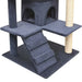 Dark blue multi-storey cat tree with sisal scratching posts, ramp, and cubby holes