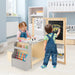 Children's art desk with drawing materials and storage shelves in a bedroom setting with kids playing and drawing