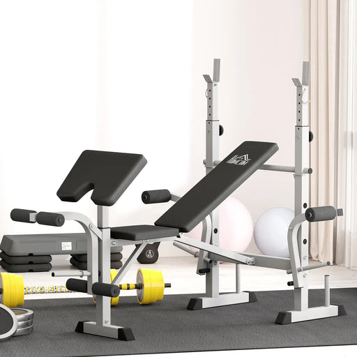 Gym bench and weight rack with weights on a gray floor.