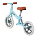 Blue no-pedal balance bike with adjustable brown seat and white tires on white background