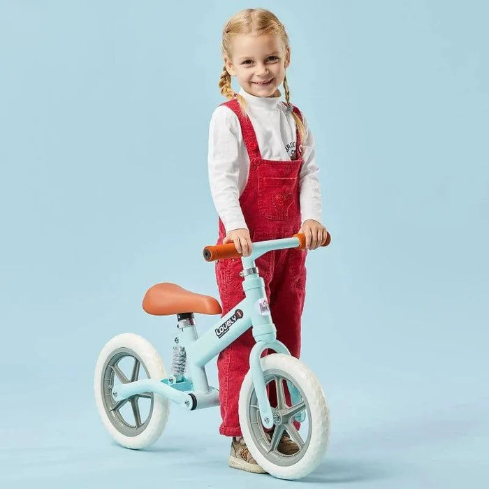 Child with blue no-pedal balance bike, adjustable seat, metal frame, on light blue background