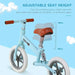 Blue no-pedal balance bike with adjustable seat, white wheels, and metal frame for kids.