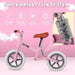 Pink no-pedal balance bike with adjustable seat, shock absorption and lightweight frame
