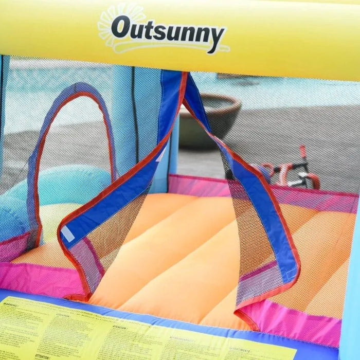 Outsunny inflatable bouncy castle entrance with mesh netting and bright colors by a pool