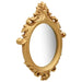 Decorative gold mirror with intricate designs on a white background