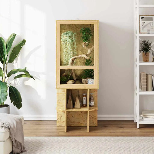 Wooden display cabinet with plants and decor items in a room setting.