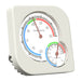 White thermometer and hygrometer on a white background
