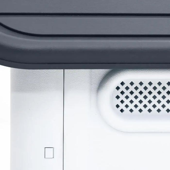 Close-up of grey and white outdoor dog house wall with ventilation grid panel