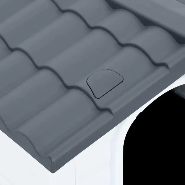 Grey ventilated roof of outdoor dog house kennel, close-up of durable plastic material