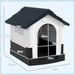 Outdoor plastic dog kennel with slanted roof, raised base, ventilated windows, and measurements