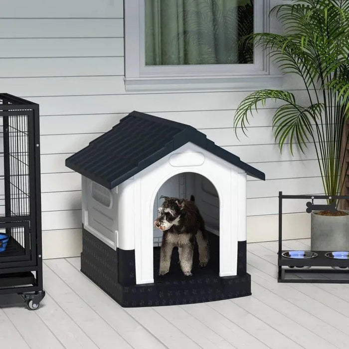 Small dog in outdoor plastic dog kennel with raised base, slanted roof, and ventilated windows