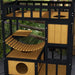 Outdoor wooden cat house with yellow panels, four levels, balcony and suspension bridge