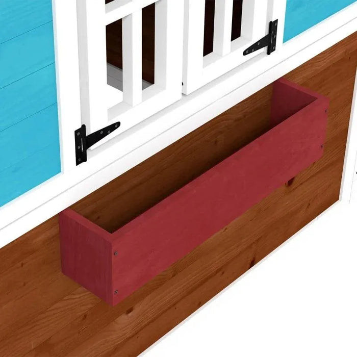Outdoor wooden playhouse with white-framed window, blue panel, and red planter box