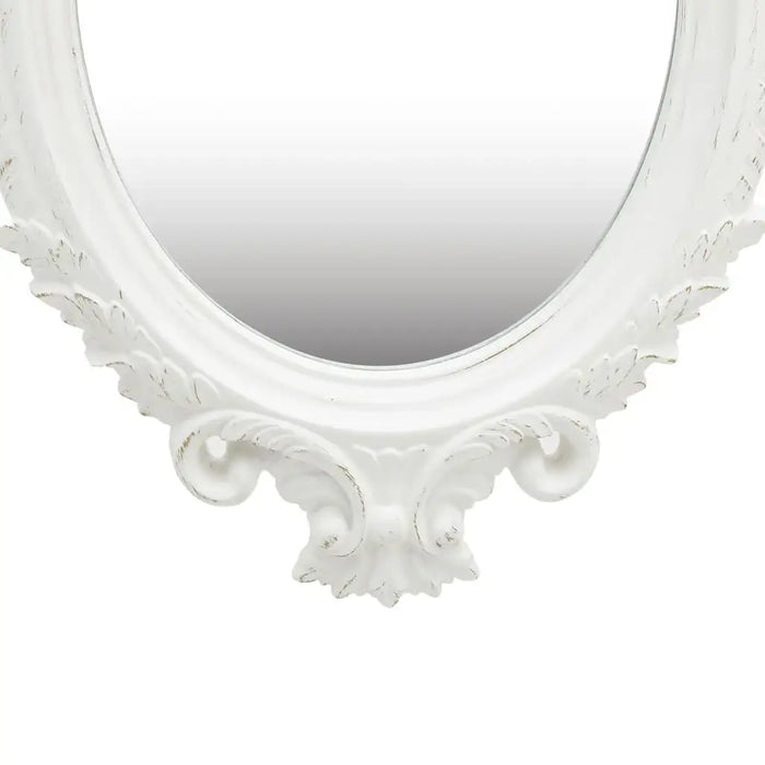Decorative white mirror with intricate detailing on a white background