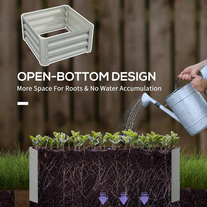 Raised garden bed with open-bottom design, showing plant roots and watering by hand for better drainage