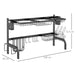 Black kitchen rack with shelves, hooks, and baskets on a white background