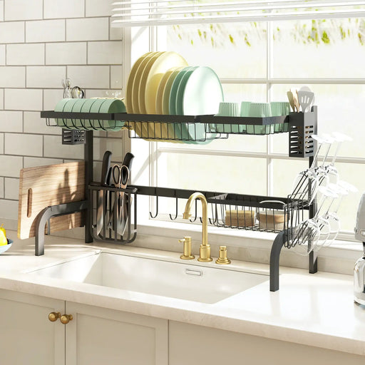 Kitchen dish rack with plates, utensils, and a cutting board above a sink.