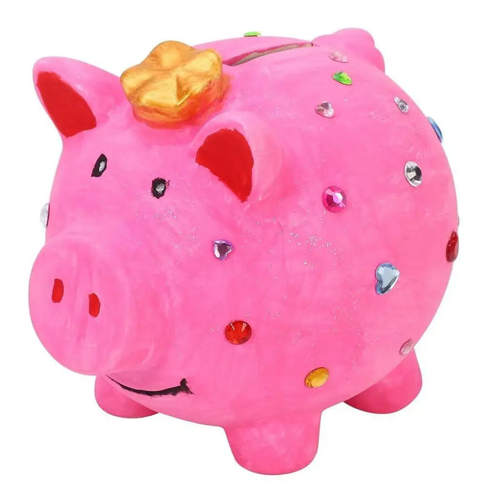 Pink piggy bank decorated with colorful sticky gems and a golden bow, kids craft kit