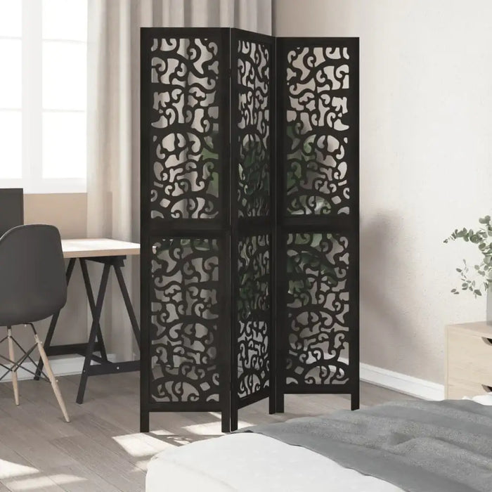 Black decorative screen in a room with a desk and chair.