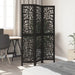 Black decorative screen in a room with a desk and chair.
