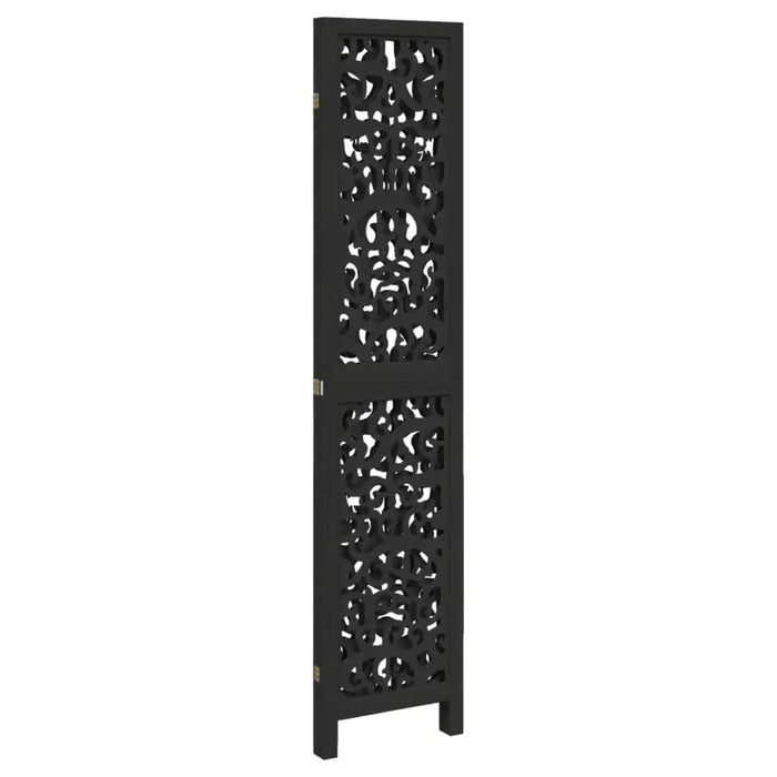 Black decorative radiator cover with intricate cut-out patterns on a white background