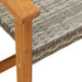 Close-up of grey PE rattan garden chair with wooden armrest, outdoor seating at Little and Giant Explorers