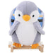 Plush penguin rocking horse with wooden base and blue padded seat for kids