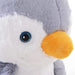 Close up of plush penguin rocking horse with soft grey and white fur and yellow beak