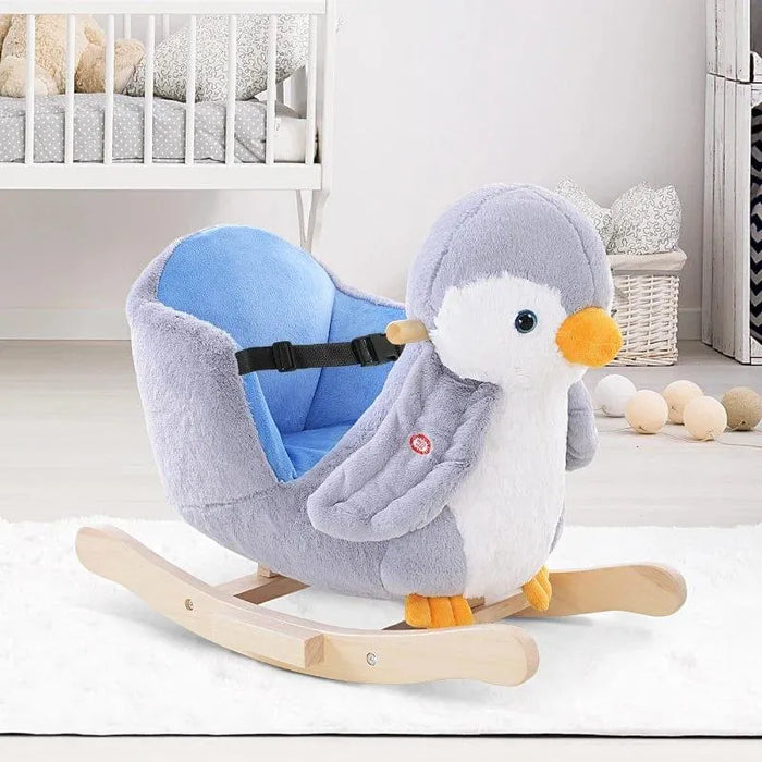 Penguin plush rocking horse with wooden frame and seat in a modern nursery