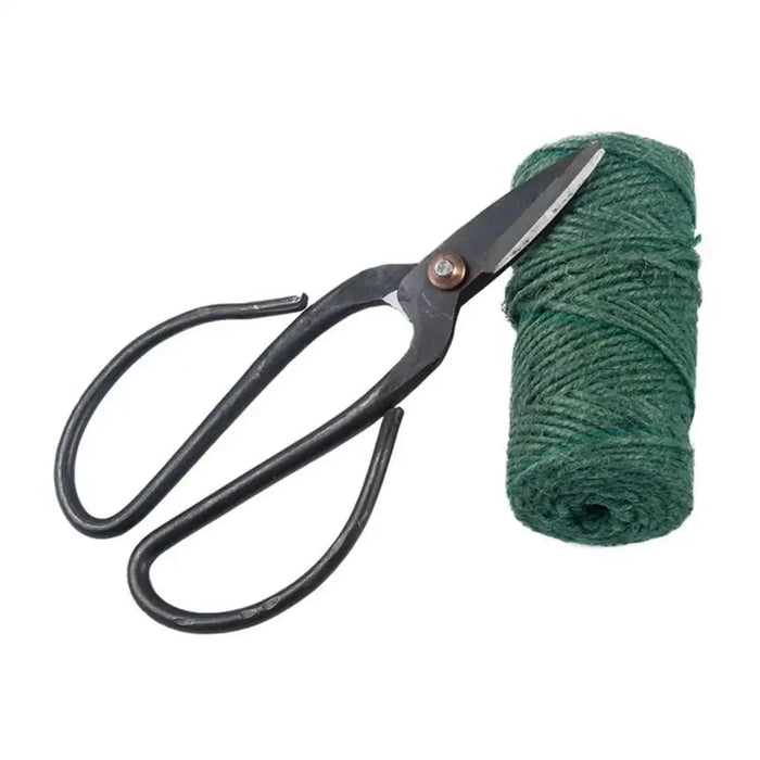 Garden scissors and green jute twine set for pruning and plant tying on white background