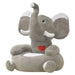 Plush elephant chair with a red heart on a white background