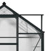 Polycarbonate greenhouse with grey aluminum frame and transparent panels