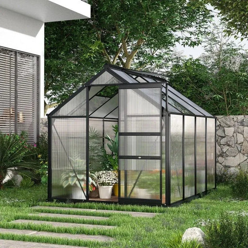 Polycarbonate greenhouse with black aluminium frame and sliding door in modern garden