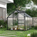 Polycarbonate greenhouse with black aluminium frame and sliding door in modern garden