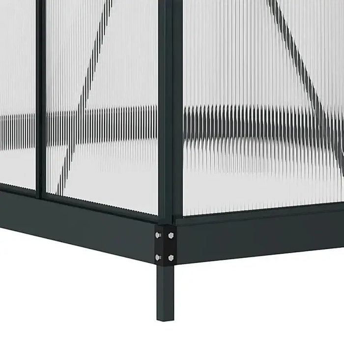 Polycarbonate greenhouse corner with grey aluminum frame and sliding door panel detail
