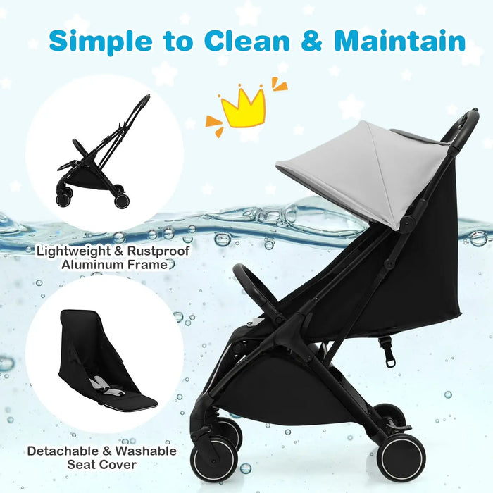 Black stroller with detachable seat cover on a water droplet background, emphasizing ease of cleaning and maintenance.