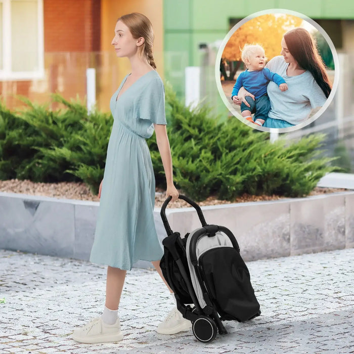 Woman in a light blue dress pushing a black stroller on a sidewalk with a small inset showing a family moment.