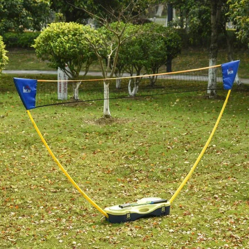 Portable badminton set with net and suitcase kit set up on green grass outdoors