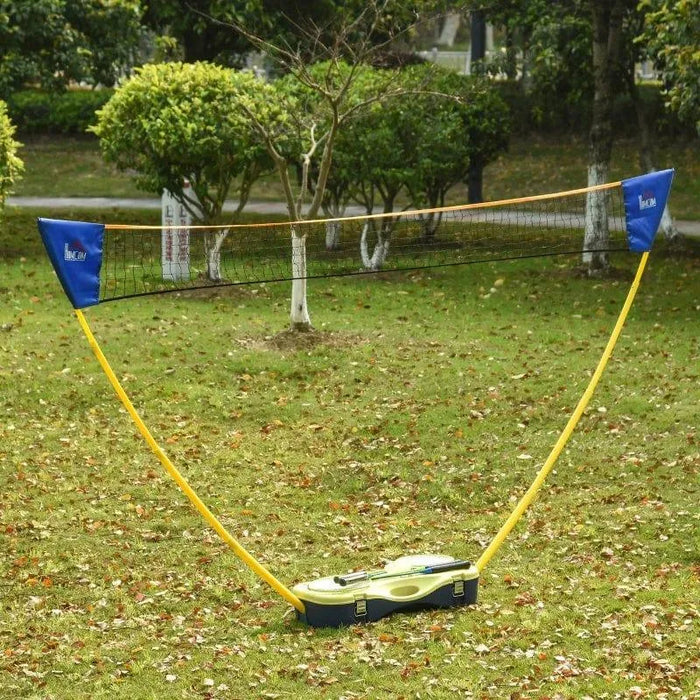 Portable badminton set with net and suitcase kit set up on green grass outdoors